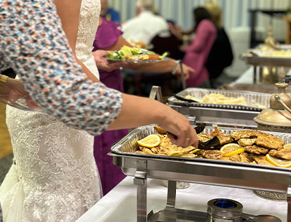 Bride at wedding dinner prepared by Nick's Place catering in new hampshire